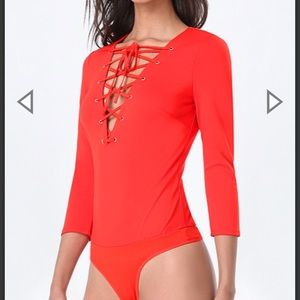 bebe Tops - Ponte lace up bodysuit (NWOT) bebe Tops - Ponte lace up bodysuit (NWOT)